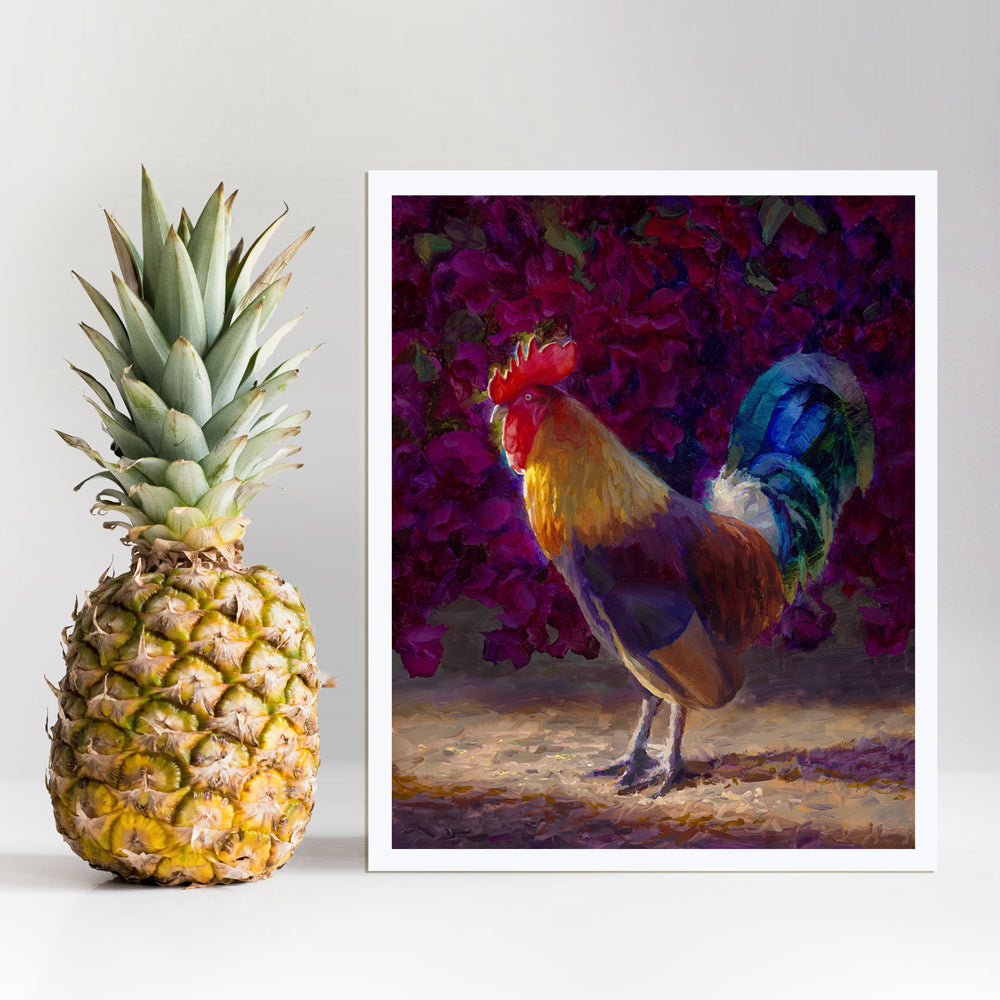 Rooster wall art print of a painting depicting a male chicken standing in front of a flowering bougainvillea bush. The rooster decor print is displayed next to a pineapple.