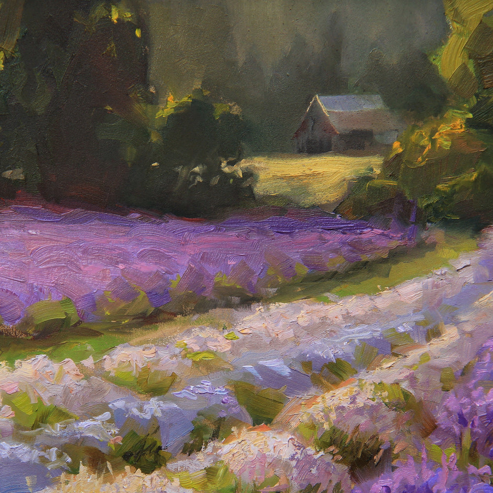 Framed lavender field wall art painting featuring a rural farmhouse landscape at sunset. In the background a rustic barn stands against a forest of green trees.