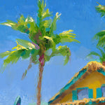 Close up of palm tree in surf painting with surf shack on the beach.