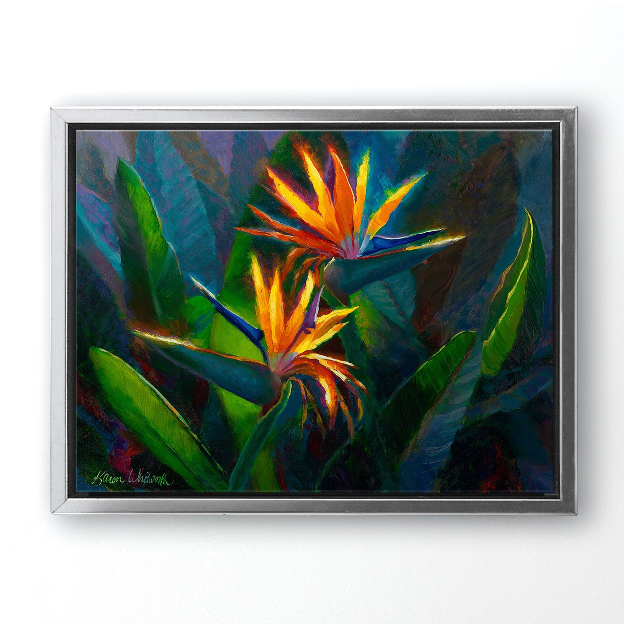 Hawaiian Flower Painting with tropical bird of paradise canvas art print by Hawaii artist Karen Whitworth. The artwork is framed in a silver float frame and hanging on a white wall.
