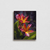 Wall art canvas of tropical Hawaiian Plumeria flower blossoms on a white wall