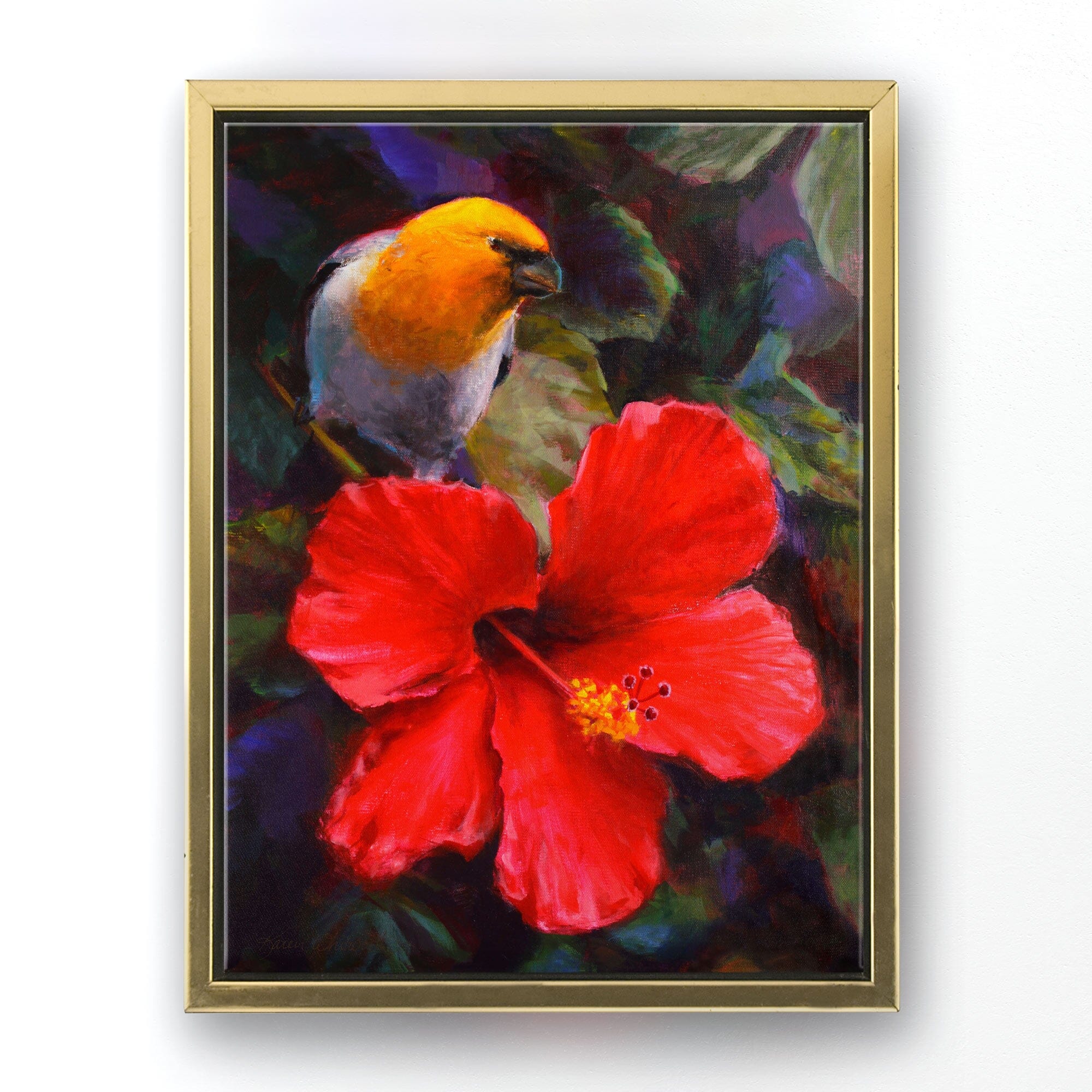 Tropical canvas art of Native Hawaiian Koki'o 'ula Hibiscus flower and  and Palila bird by artist Karen Whitworth. The artwork is framed in a gold floater frame and is  hanging on a white wall.