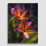 Wall art canvas of tropical Hawaiian Plumeria flower blossoms on a white wall