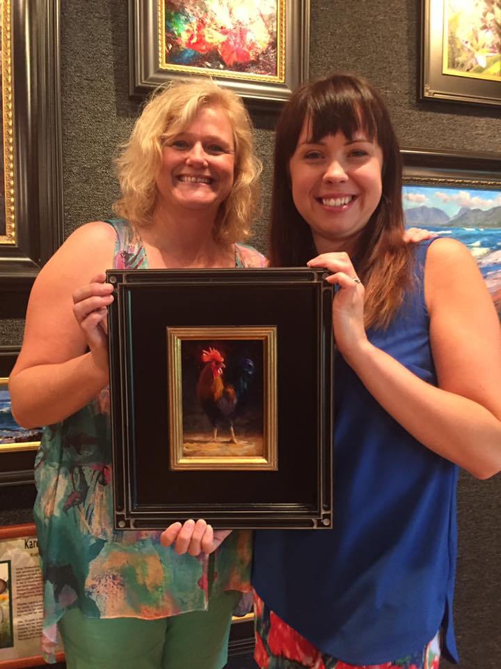 Karen Whitworth and Collector with Rooster painting at Tabora Gallery Kauai