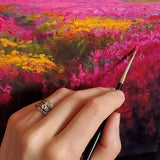 Artist Karen Whitworth paints wildflowers.
