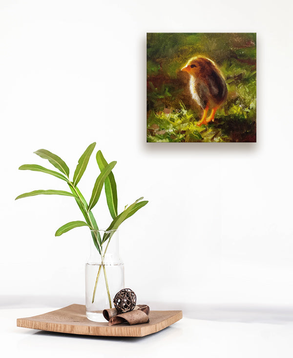 Chicken wall art canvas of baby chick, by Hawaii Gallery Artist Karen Whitworth hanging on white wall with vase and leaves.