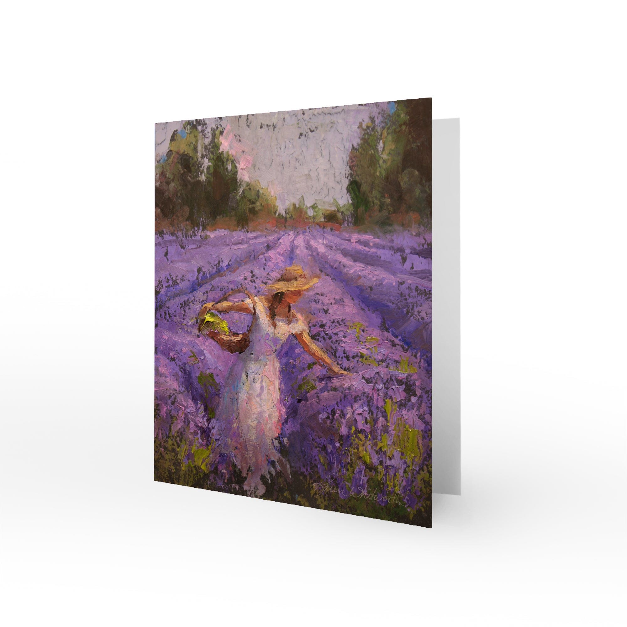 Lavender greeting card with painting of woman harvesting purple flowers in a blooming lavender field. The image is a floral painting by landscape artist Karen Whitworth. The card has a blank inside and comes with a white envelope.