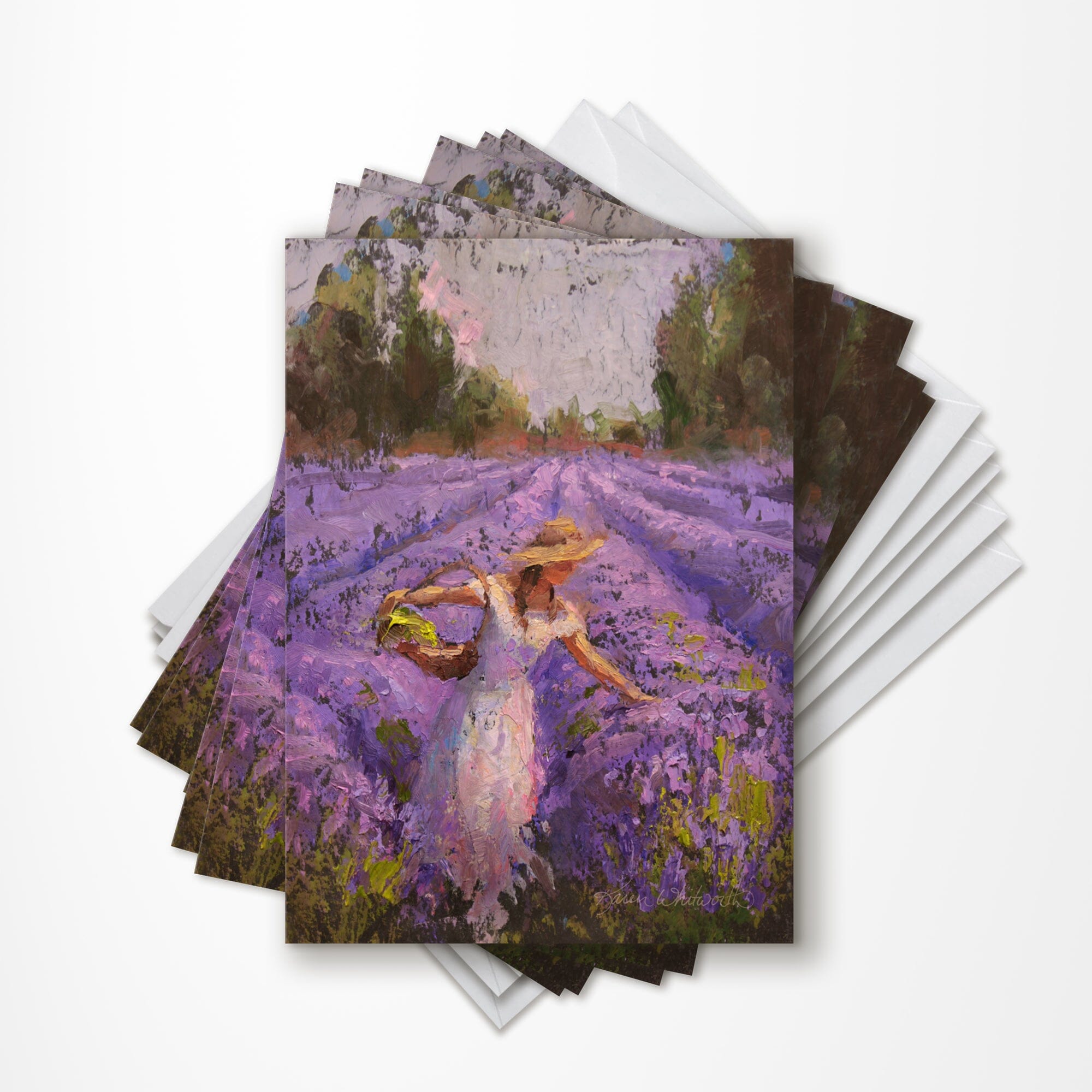 A set of 6 lavender greeting cards resting on white envelopes