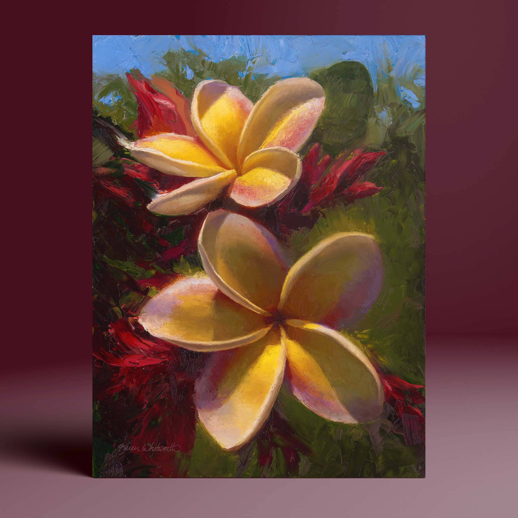 Colorful plumeria painting of 2 yellow flowers against a green background. This tropical flower wall art print was painted by artist Karen Whitworth.
