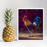 Rooster wall art print of a painting depicting a male chicken standing in front of a flowering bougainvillea bush. The rooster decor print is displayed next to a pineapple.