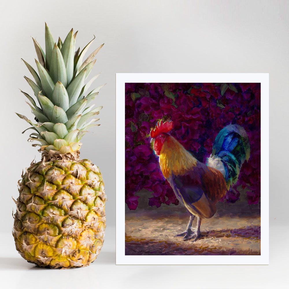 Rooster wall art print of a painting depicting a male chicken standing in front of a flowering bougainvillea bush. The rooster decor print is displayed next to a pineapple.