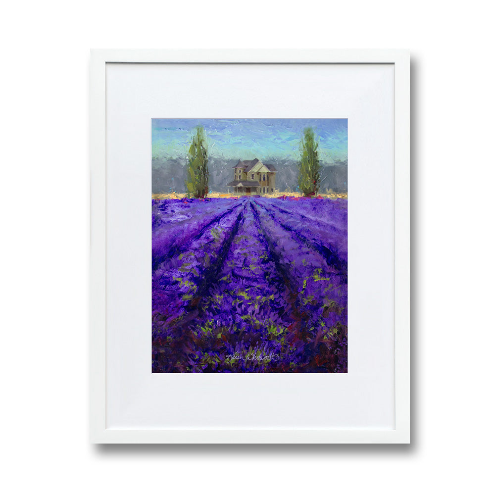 Farmhouse wall art of lavender fields landscape painting. The artwork is framed in a white wood frame and picture mat on a white wall.