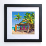 Framed surf wall art print of beach painting with a tropical shack with surf boards leaning on the sunny porch of a dreamy beach house.
