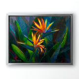 Hawaiian Flower Painting with tropical bird of paradise canvas art print by Hawaii artist Karen Whitworth. The artwork is framed in a silver float frame and hanging on a white wall. 
