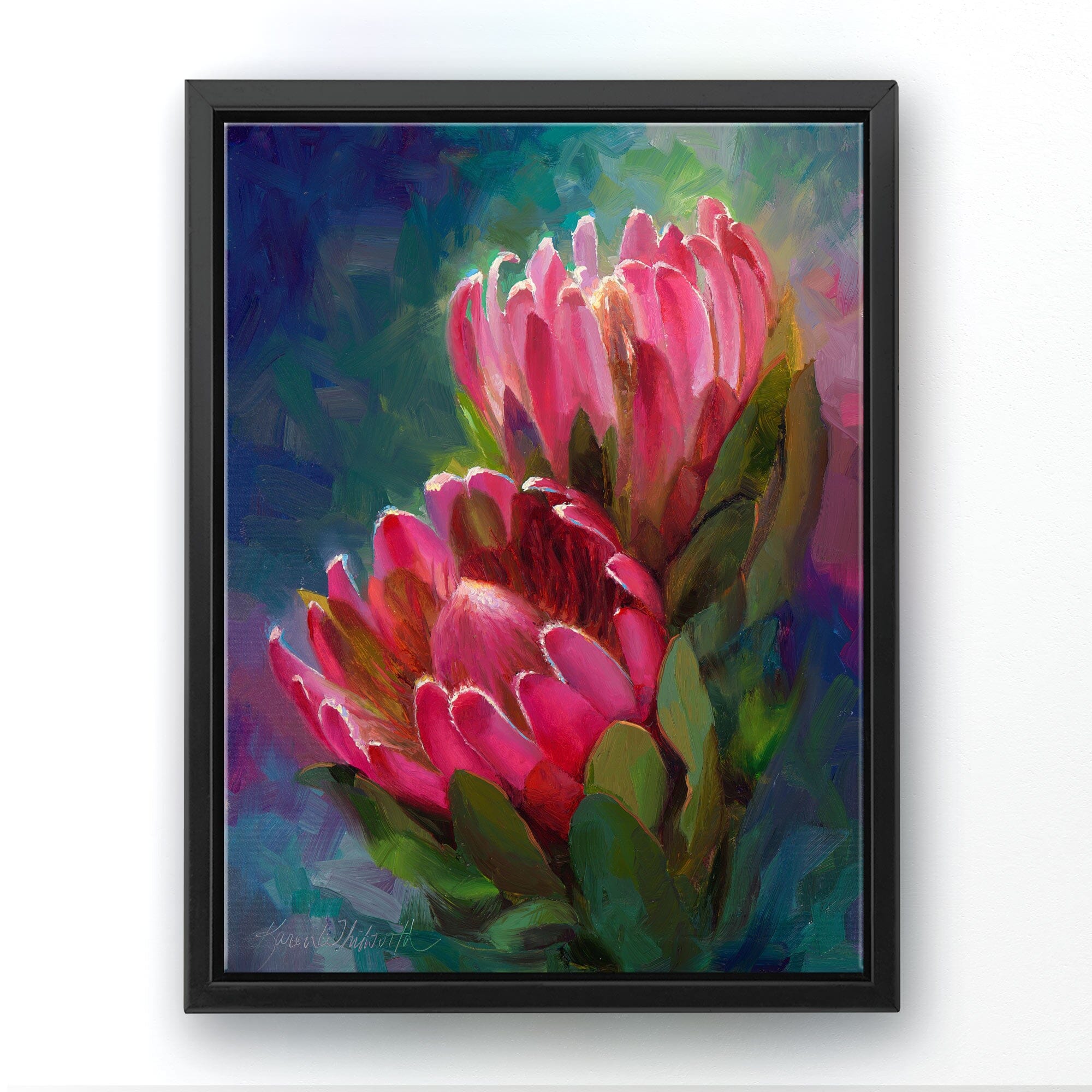 Protea canvas art of tropical pink flowers by floral artist Karen Whitworth. The artwork is framed in a black floater frame and is hanging on a white wall. 