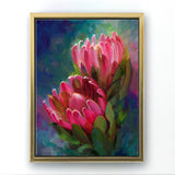Protea canvas art of tropical pink flowers by floral artist Karen Whitworth. The artwork is framed in a gold floater frame and is  hanging on a white wall. 