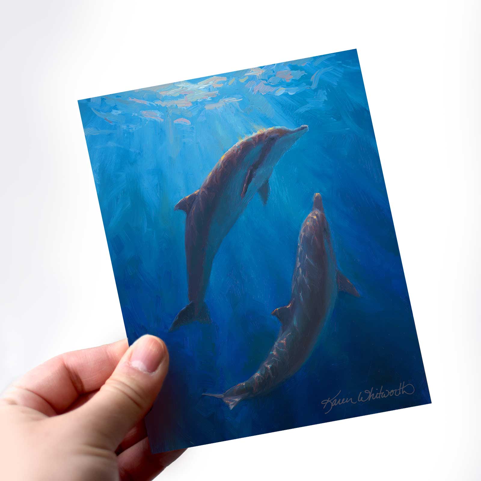 Dolphin Dance greeting card with deep blue ocean colors by Alaska artist Karen Whitworth