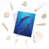 Dolphin greeting card with whales on front of ocean themed stationery