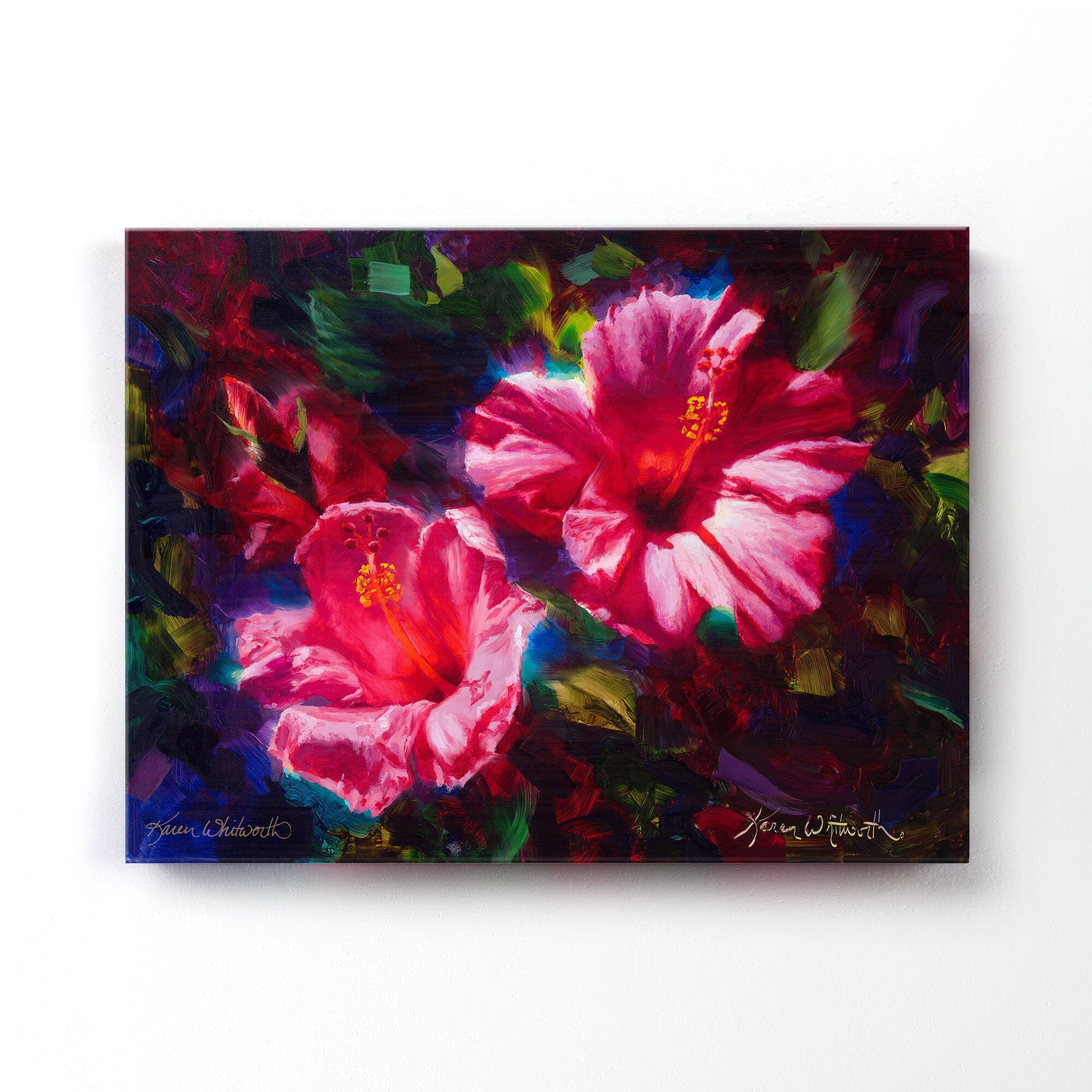 pink hibiscus Hawaiian flower painting on canvas by Hawaii artist Karen Whitworth. The artwork is hanging on a white wall.