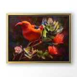 Hawaiian canvas art flower painting of ohia tree and iiwi bird by Hawaii artist Karen Whitworth. The artwork is in a gold frame and is hanging on a white wall. 
