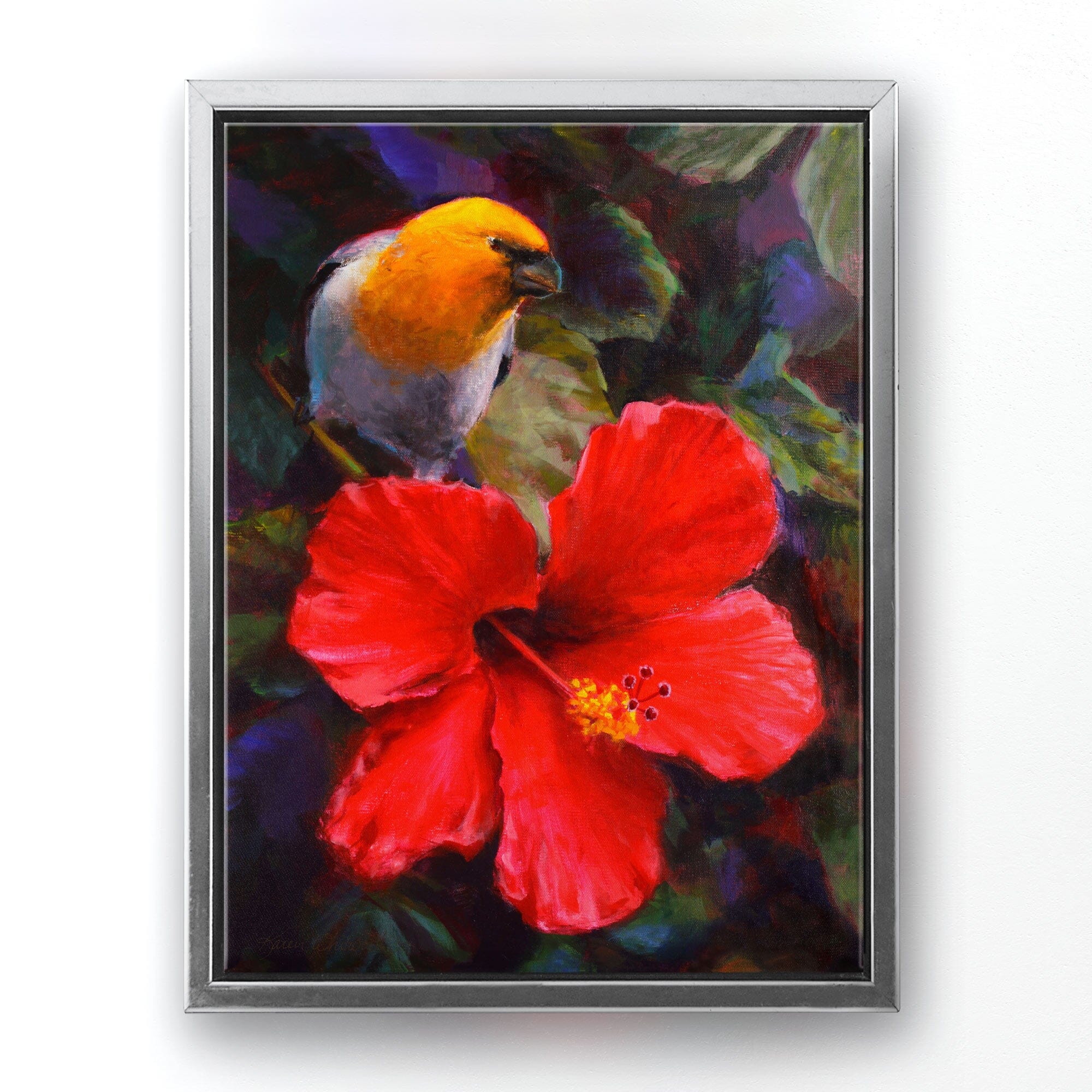 Tropical canvas art of Native Hawaiian Koki'o 'ula Hibiscus flower and and Palila bird by artist Karen Whitworth. The artwork is framed in a silver floater frame and is hanging on a white wall.