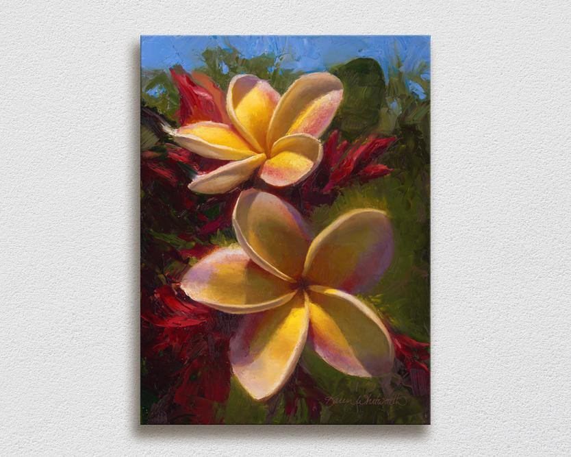 Wall art canvas of tropical Hawaiian Plumeria flowers painting by Hawaii artist Karen Whitworth on white wall